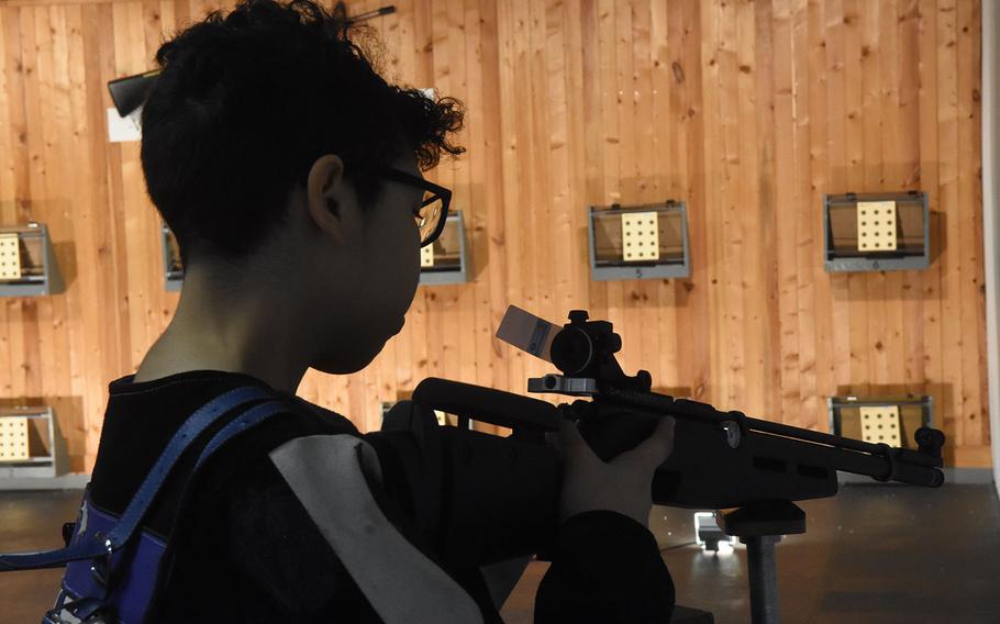 Ansbach's Tia Crisp reloads during a marksmanship match at Ansbach, Germany, Saturday, Jan. 20, 2018.