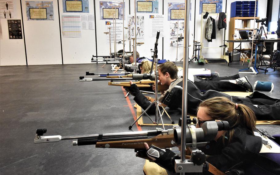 Shooters eye their targets during a marksmanship match at Ansbach, Germany, Saturday, Jan. 20, 2018. 