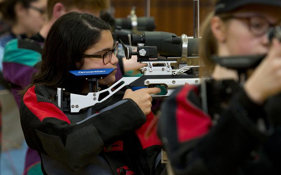 Ansbach's Eliana Vales fires during the DODEA-Europe Marksmanship championship at Vogelweh, Germany, on Saturday, Feb. 3, 2018.