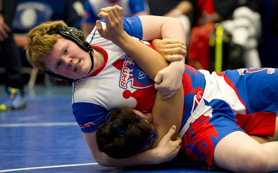 Ramstein's Sean Elliott maneuvers Rota's Gavin Vasquez for a pin during a match at Ramstein Air Base, Germany, on Saturday, Feb. 10, 2018.