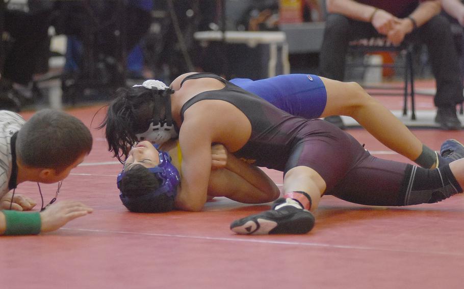 Vilseck's Anthony Cruz pins Sigonella's Noah Bachicha at 120 pounds to win the weight class Saturday at the southern sectional.