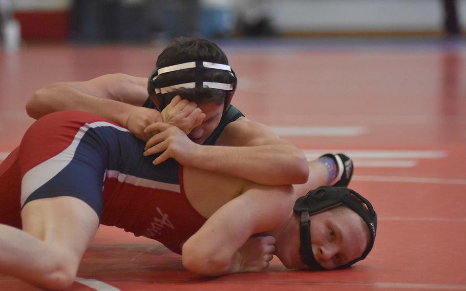 Naples' Jackson Blivin has control of Aviano's Ethan Laws at 152 pounds in the southern sectional Saturday at Aviano Air Base, Italy. Blivin eventually took first and Laws second.