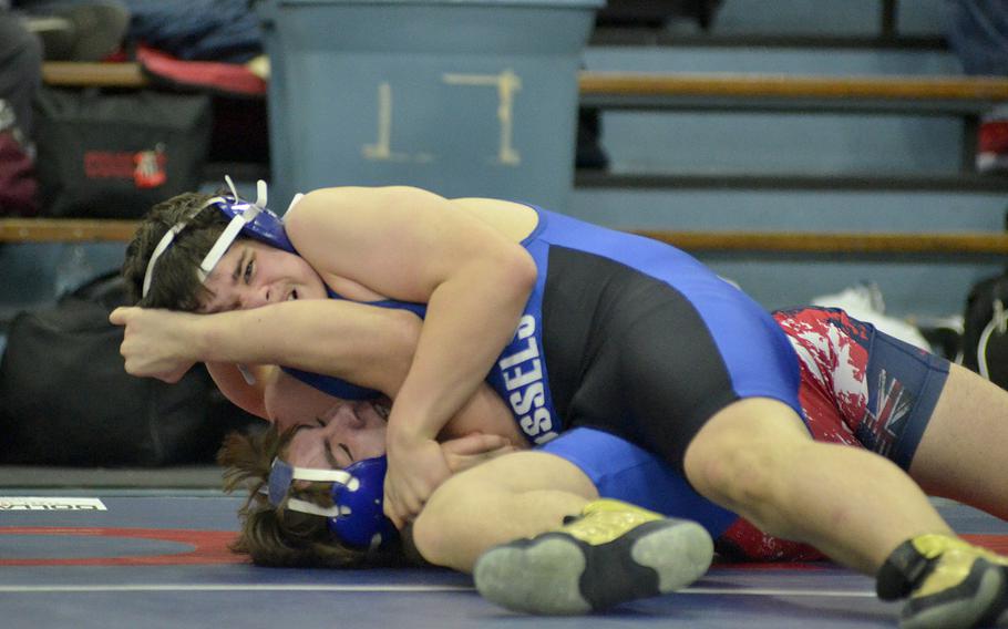 Brussels wrestler Leo Driggers struggles to pin Lakenheath's Nick Scifo to the mat during the northern sectional at RAF Lakenheath, England, Saturday, February 10, 2018. Driggers beat Scifo with the pin and secured a spot in the upcoming DODEA-European wrestling championships.