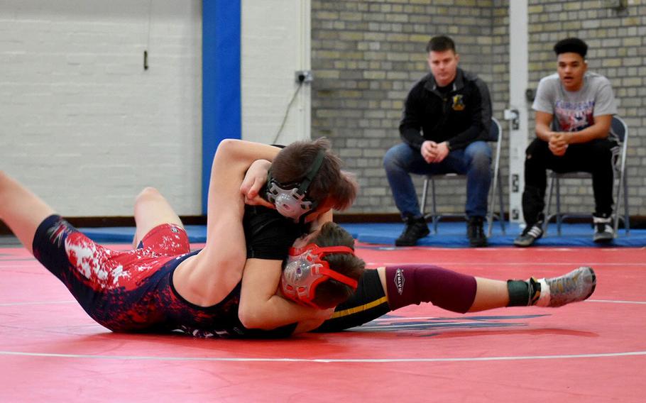 Alconbury wrestler Vivian Newcomer looks to pin Lakenheath's Kaleb Molloy after throwing him to the mat during the northern sectional at RAF Lakenheath, England, Saturday, February 10, 2018. "She's all heart and everybody sees it. When she takes the mat she comes to compete," Alconbury coach Michele Jackson said about Newcomer.