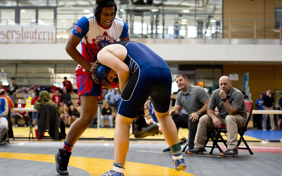 Ramstein's Milo Clark, left, tries to break free from Rota's Cooper MacNicholl during the DODEA-Europe wrestling championships in Wiesbaden, Germany, on Friday, Feb. 16, 2018. Clark pinned MacNicholl to win the match.