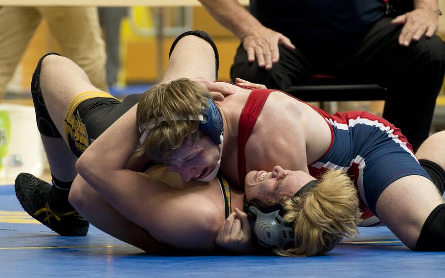 Aviano's Mitchel Schaul tries to pin Stuttgart's Robert Baumback during the DODEA-Europe wrestling championships in Wiesbaden, Germany, on Friday, Feb. 16, 2018. Schaul eventually won the 170-pound match.