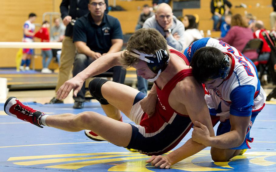 Ramstein's Dante Lapitan, right, tries to flip Aviano's Liam Knowles during the DODEA-Europe wrestling championships in Wiesbaden, Germany, on Friday, Feb. 16, 2018. Lapitan won the 132-pound match.