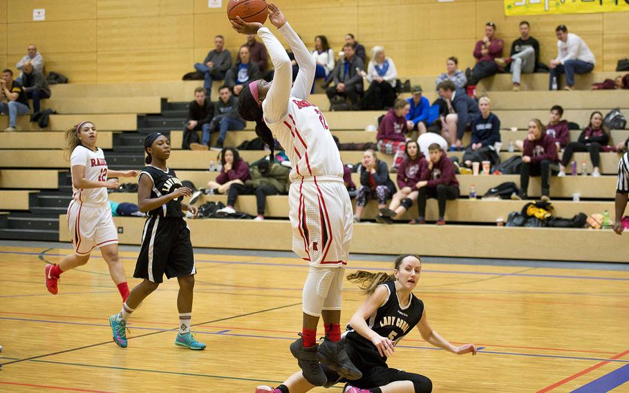 Kaiserslaiutern's Le'Jhanique, left, shoots over Vicenza's Grace Bello during the DODEA-Europe basketball championships in Wiesbaden, Germany, on Thursday, Feb. 22, 2018. Kaiserslautern won 56-17.