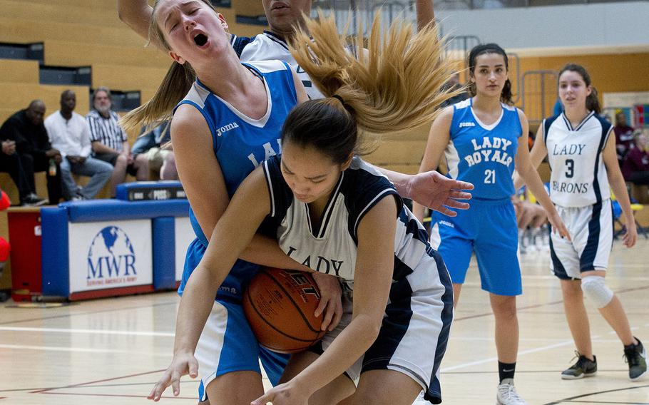 Marymount's Arna Mathiesen, left, and Spangdhalem's Justine Tila battle for the ball during the DODEA-Europe basketball semifinals in Wiesbaden, Germany, on Friday, Feb. 23, 2018. Marymount lost the Division II game 23-18.