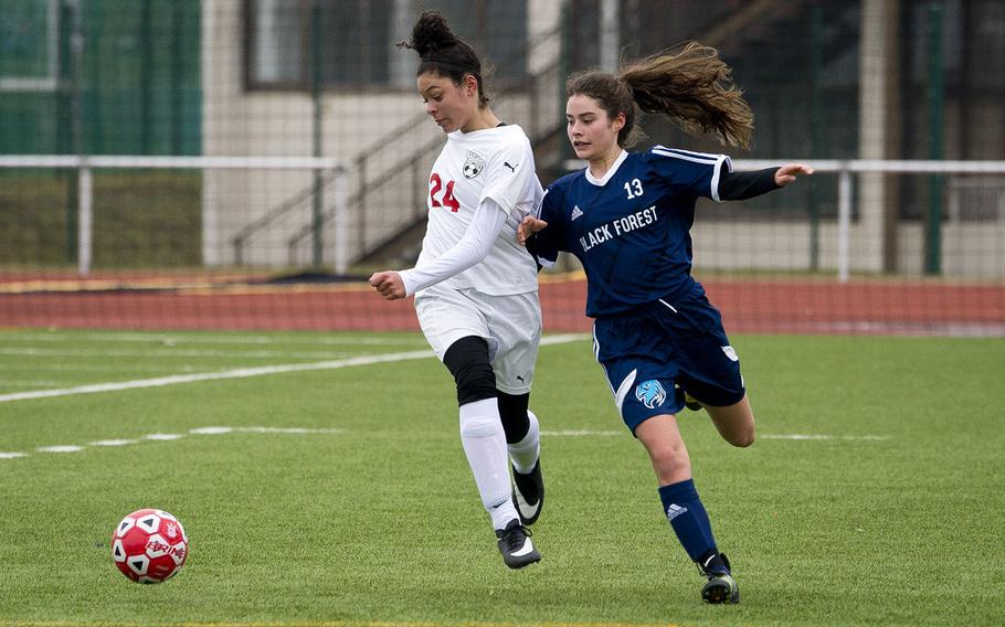 Kaiserslautern's Dezirea Johnson, left, and Black Forest Academy's Debbie Widmer race for the ball in Kaiserslautern, Germany, on Saturday, March 17, 2018. Kaiserslautern and BFA tied the game 1-1.