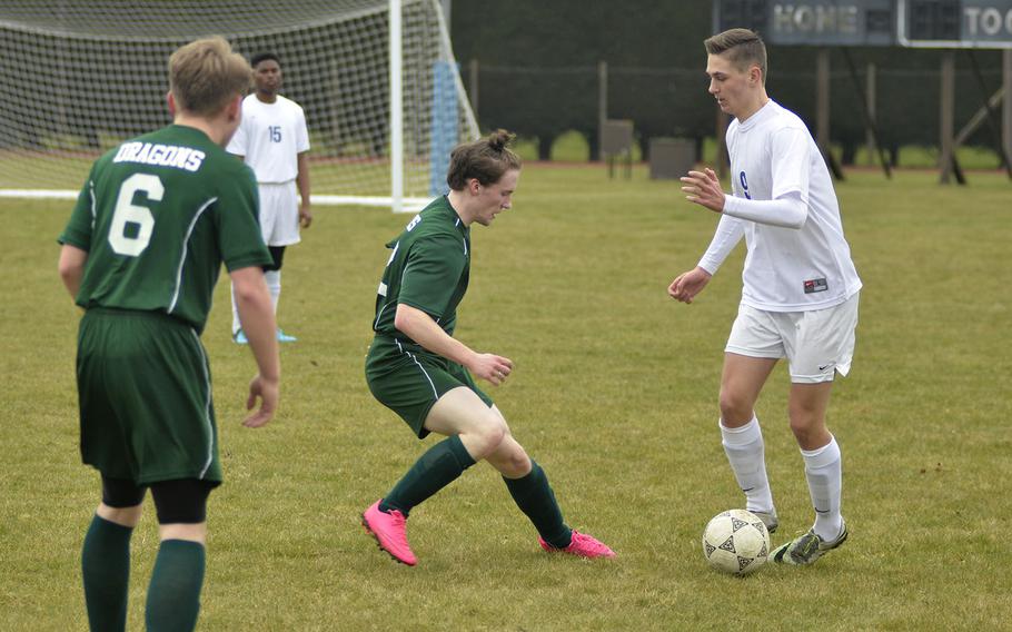 Alconbury's Jason Sanders defends against Brussels player Aljaz Urbanc during a soccer game at RAF Alconbury, England, Saturday, March 24, 2018. Urbanc earned the only goal in the 1-0 Brussels victory.