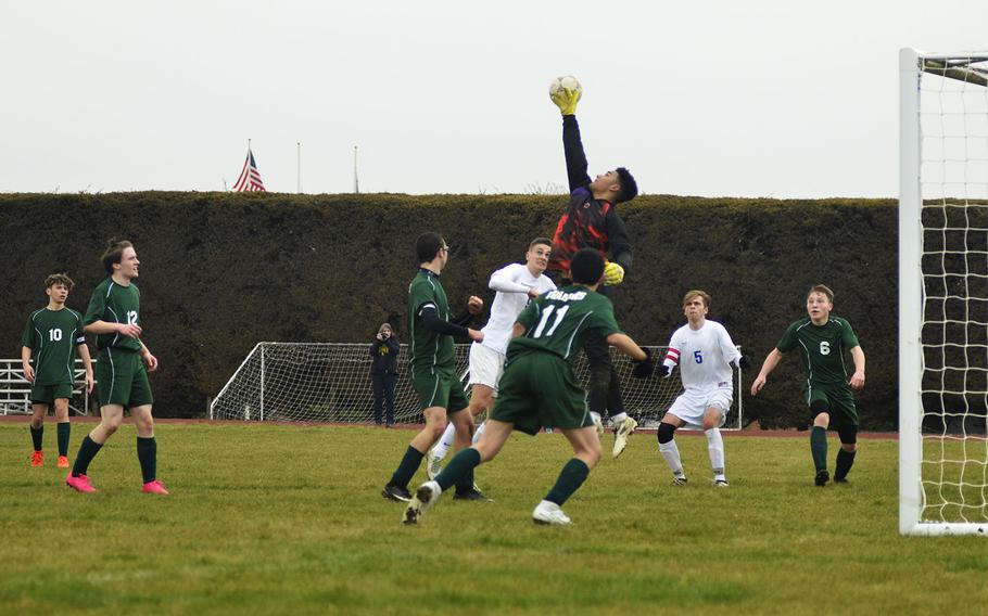 Alconbury's Dee Wilson defends the goal against Brussels during a soccer game at RAF Alconbury, England, Saturday, March 24, 2018. Wilson had 15 saves in the 1-0 loss against the Brigands
