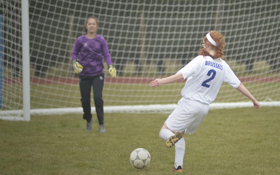 Brussels' Savannah Vitale shoots on Alconbury's goal during a soccer game at RAF Alconbury, England, Saturday, March 24, 2018. Vitale earned a goal for the Brigands within the first minute of the game.