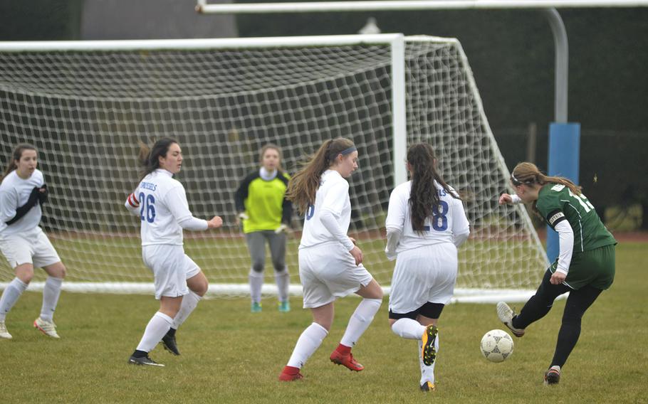 Alconbury's Laela Evans shoots on the Brussels goal during a soccer game at RAF Alconbury, England, Saturday, March 24, 2018. Evans scored two goals in her team's win against the Brigands.
