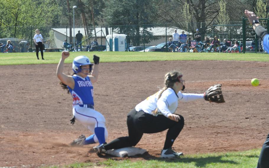 Ramstein runner Emi Yamakazi slides safely into third base before the ball can reach Stuttgart's Rachel Johnson in the Royals' 15-6 victory on Saturday, April 14, 2018 at Ramstein Air Base.