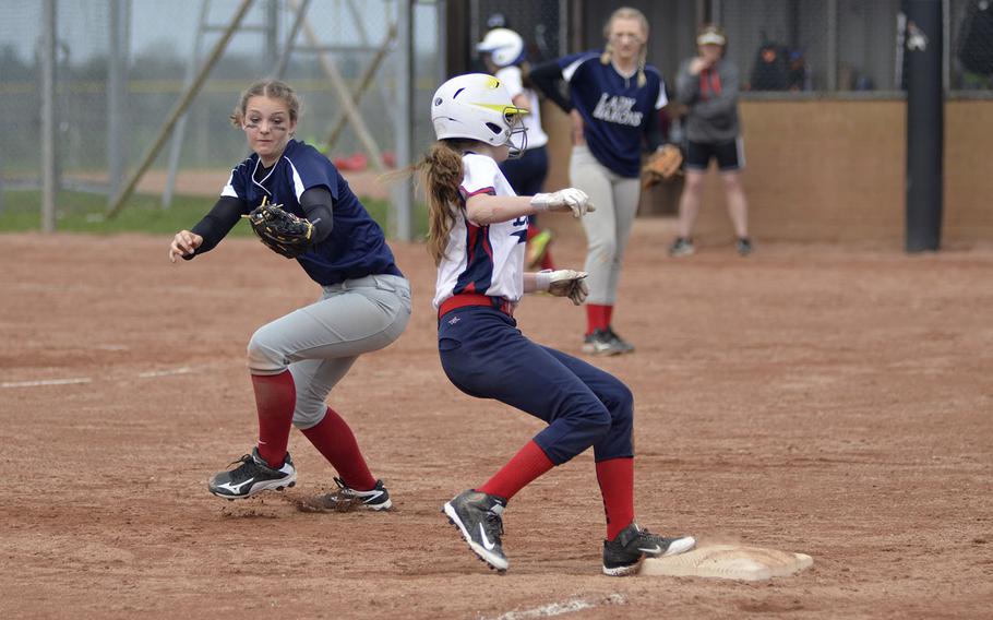 Lakenheath's Summer Gregorcyk reaches third base before Spangdahlem's Krista Higley can tag her out during a high school softball doubleheader at RAF Lakenheath, England, Saturday, April 14, 2018. The Lancers won 22-11 in each game. 