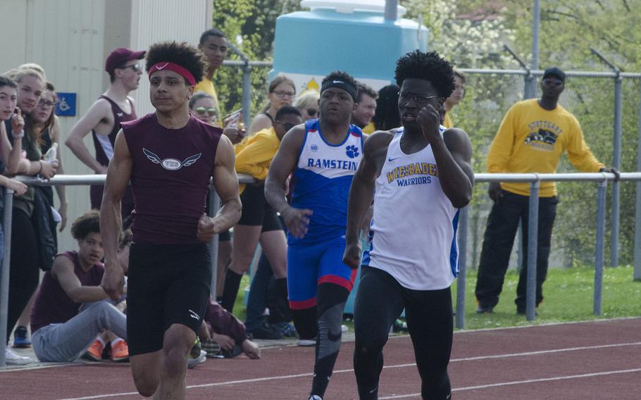 Vilseck's Devin Gamble, left, and Wiesbaden's Caleb Brown near the finish line in the 200 meters during a 10-team meet in Wiesbaden, Germany, Saturday, April 14, 2018. Gamble edged out Brown by .06 seconds.