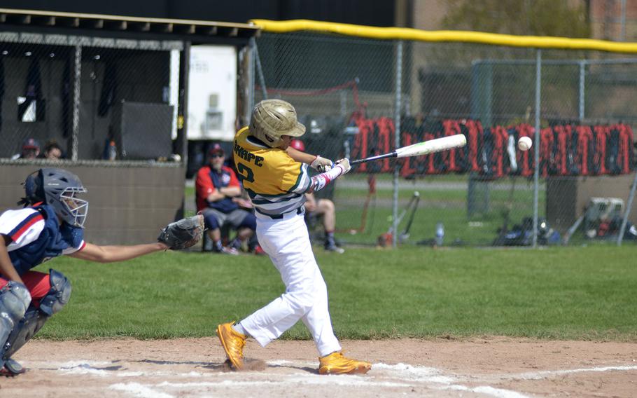 SHAPE's Jared Gallegos gets a base hit against the Lancers during a high school baseball doubleheader at RAF Feltwell, England, Saturday, April 21, 2018. The Spartans beat the Lancers in both games. 