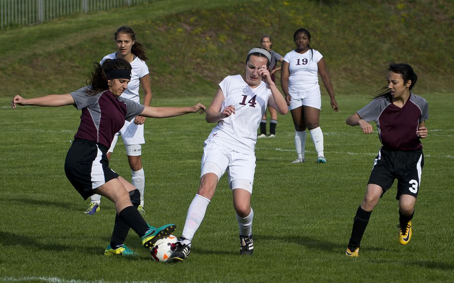 Baumholder's Abigail Maracle tries to get between AFNORTH's Laura Teichl, left, and Alexis Malham in Baumholder, Germany, on Friday, April 27, 2018.