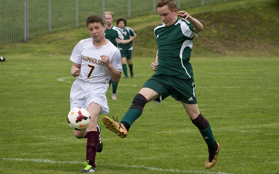 AFNORTH's Damien Corser, right, passes the ball in front of Baumholder's Noel King in Baumholder, Germany, on Friday, April 27, 2018. AFNORTH won the game 15-0.
