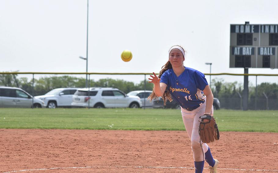 Sigonella's Jessica Jacobs tosses the ball toward home while throwing a no-hitter against Hohenfels on Saturday, April 28, 2018. The Jaguars won 10-0.