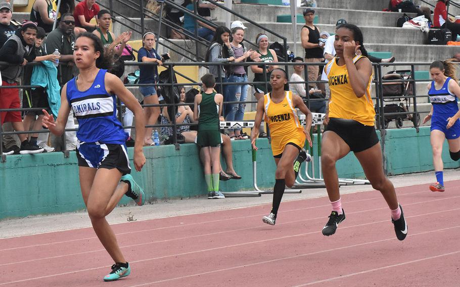 Rota's Deja Alexis sprints to victory in the 100-meter run on Saturday May 12, 2018 at Naples Middle High School in Gricignano, Italy. 