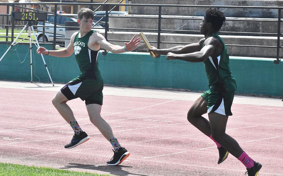 Naples' Johna Joseph passes the baton to anchor Tim Smith in the 4x400 relay on Saturday May 13, 2018 at Naples Middle High School. They would win the event. 

