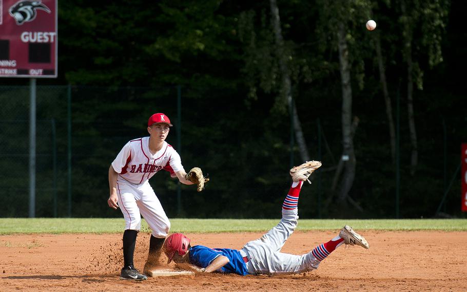 Ramstein's Kaleb Bellew slides in safe at second ahead of a throw to Kaiserslautern's Mark Hoyt in Kaiserslautern, Germany, on Saturday, May 19, 2018.
