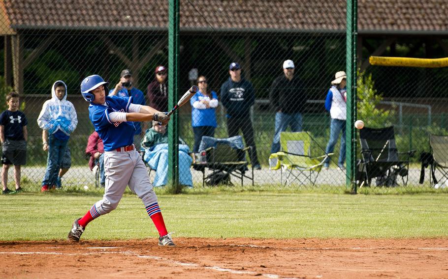 Ramstein's Christopher Guzaldo hits the ball during a game in Kaiserslautern, Germany, on Saturday, May 19, 2018. Ramstein defeated Kaiserslautern 6-5.