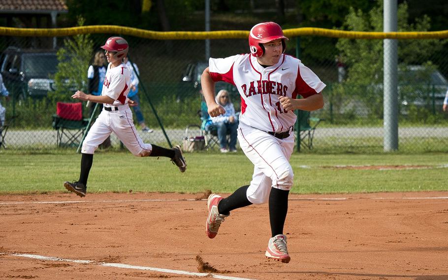 Kaiserslautern's Justice Harper, right, runs to first as Mark Hoyt makes it home during a game in Kaiserslautern, Germany, on Saturday, May 19, 2018. Kaiserslautern lost to Ramstein 6-5.