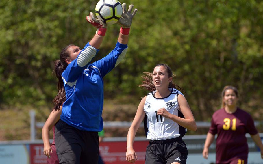 Vilseck's Mia Chon makes a save as Stuttgart's Natalie Eddy watches in Division I action at the the DODEA-Europe soccer finals in Reichenbach, Germany, Monday, May 21, 2018. Stuttgart won 4-0.



