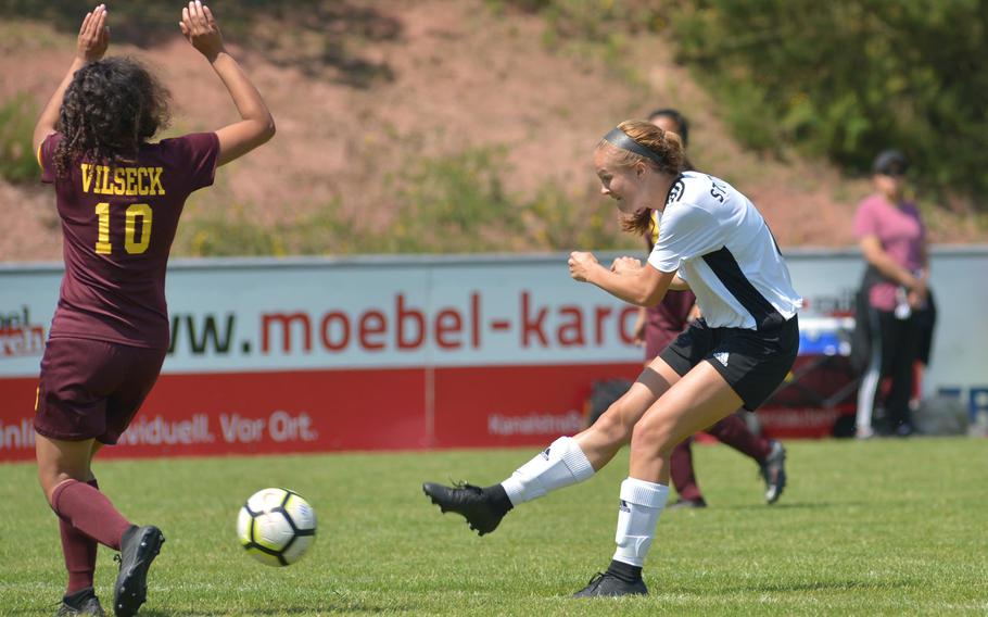 Stuttgart's Reagan Treichel shoots on goal in Division I action at the the DODEA-Europe soccer finals in Reichenbach, Germany, Monday, May 21, 2018. At left is Vilseck's Adely Huezo. The Panthers beat Vilseck 4-0.