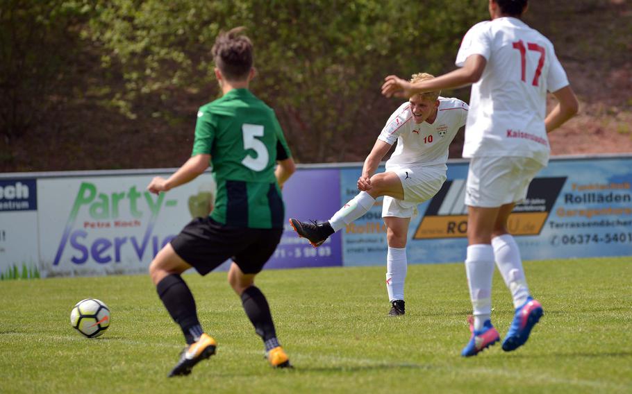 Kaiserslautern's Tyler Jankowski shoots and scores in a Division I game against Naples at the DODEA-Europe soccer finals in Reichenbach, Germany, Monday, May 21, 2018. Kaiserslautern won the game 6-1.




