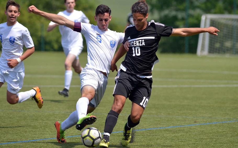 Wiesbaden's Andrew Scahill stops Vicenza's Richard Poropat in a Division I game at the DODEA-Europe soccer finals in Reichenbach, Germany, Monday, May 21, 2018. Wiesbaden won the game 6-0.




