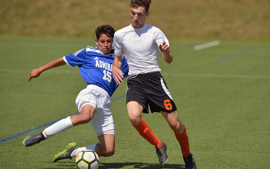 Rota's Kaden Rodriguez, left, comes in to clear in front of AFNORTH's Guillermo Rodriquez in Division II action at the DODEA-Europe soccer finals in Landstuhl, Germany, Monday, May 21, 2018. AFNORTH won 6-0.





