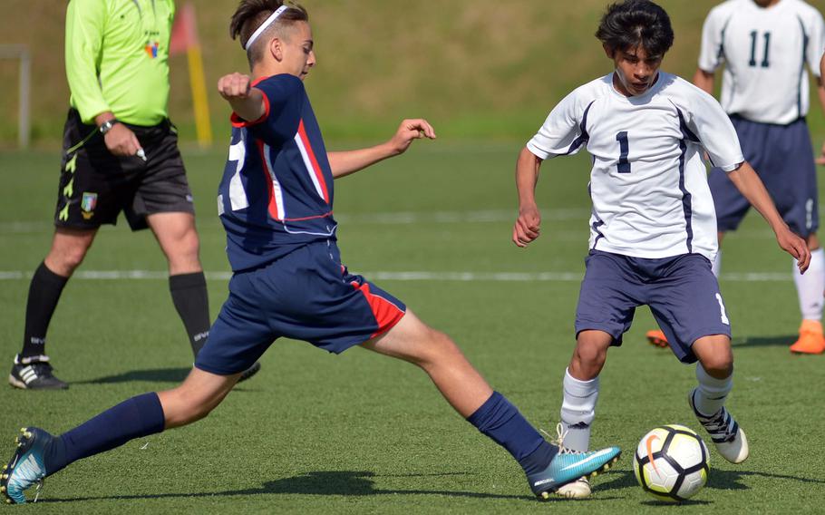 Aviano's Cole Heathcliff stretches to tip the ball away from Spangdahlem's Luis Martinez in the teams' 0-0 tie in Division II action at the the DODEA-Europe soccer finals in Landstuhl, Germany, Monday, May 21, 2018.





