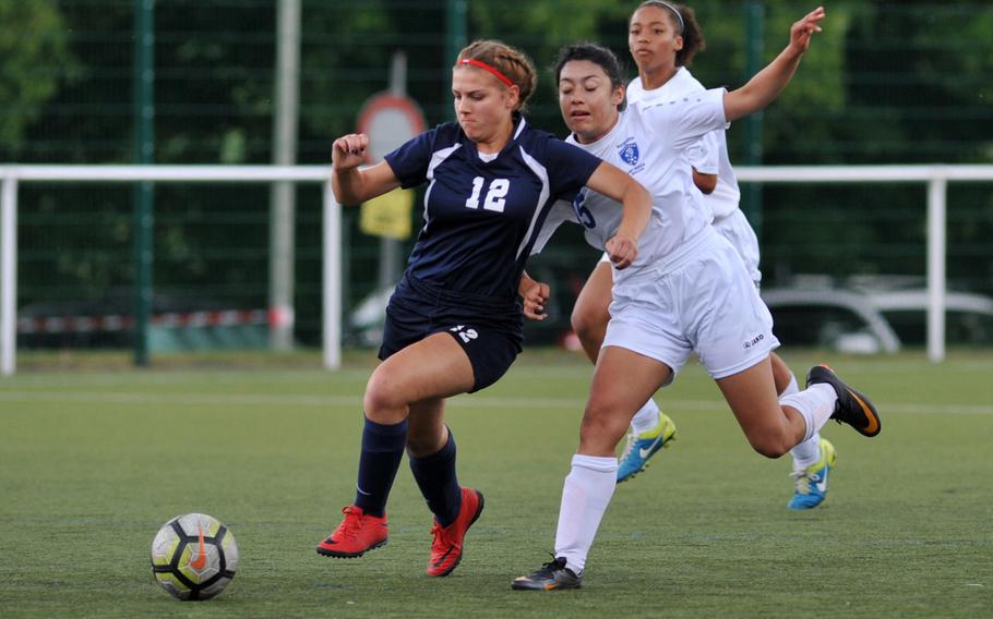 Lakenheath's Madisyn Peterson, left, chases down the ball from Wiesbaden's Brianna Greenfield at the DODEA-Europe soccer championships in Reichenbach, Germany, Tuesday, May 22, 2018. Wiesbaden went on to win the game 2-0.