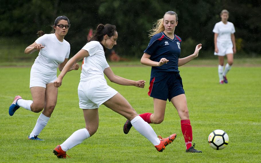 Spangdahlem's Emelia Lenz passes the ball in front of Aviano's Nilla Hall, right, as fellow Sentinel Summer Flores runs to assist during the DODEA-Europe soccer championships in Landstuhl, Germany, on Tuesday, May 22, 2018. Spangdhalem won the Division II match 7-0 and advances to the semifinals.

