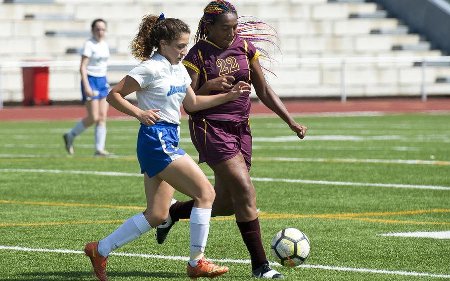 Sigonella's Aeriell Colodro, left, and Baumholder's Sierra Green race for the ball during the DODEA-Europe soccer championships in Kaiserslautern, Germany, on Tuesday, May 22, 2018. Sigonella won the Division III match 1-0.
