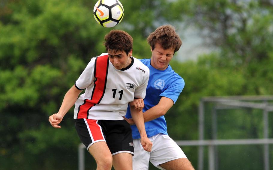 AOSR's Tommaso Articoli heads the ball away from Marymount's Mario Freilino in a Division II semifinal at the DODEA-Europe soccer finals in Reichenbach, Germany, Wednesday, May 23, 2018. Marymount won 4-2 to advance to Thursday's final.
