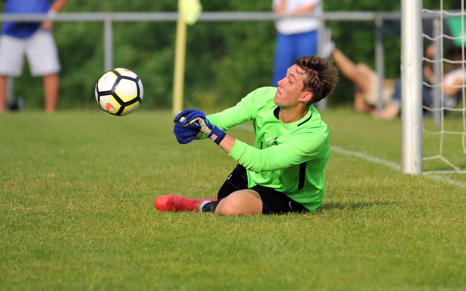 Ramstein's Garrett Erickson defuses a sharp shot on goal in his team's 1-0 loss to Stuttgart in a Division I semifinal at the DODEA-Europe soccer finals in Reichenbach, Germany, Wednesday, May 23, 2018.