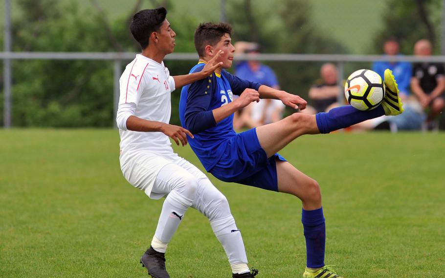 Wiesbaden's Diego Chavez uses some fancy footwork to get past Kaiserslautern's Johann Mendez in a Division I semifinal at the DODEA-Europe soccer finals in Reichenbach, Germany, Wednesday, May 23, 2018. Kaiserslautern beat the Warriors 4-1 to advance to Thursday's division final. 
