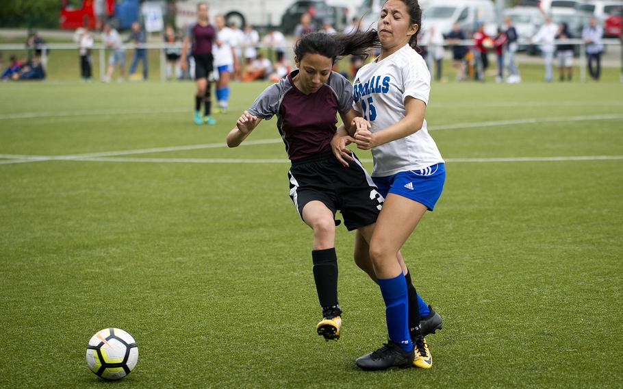 AFNORTH's Adrianna Sicardo, left, and Rota's Jasmine Garrison collide during the DODEA-Europe soccer championships in Reichenbach, Germany, on Wednesday, May 23, 2018.
