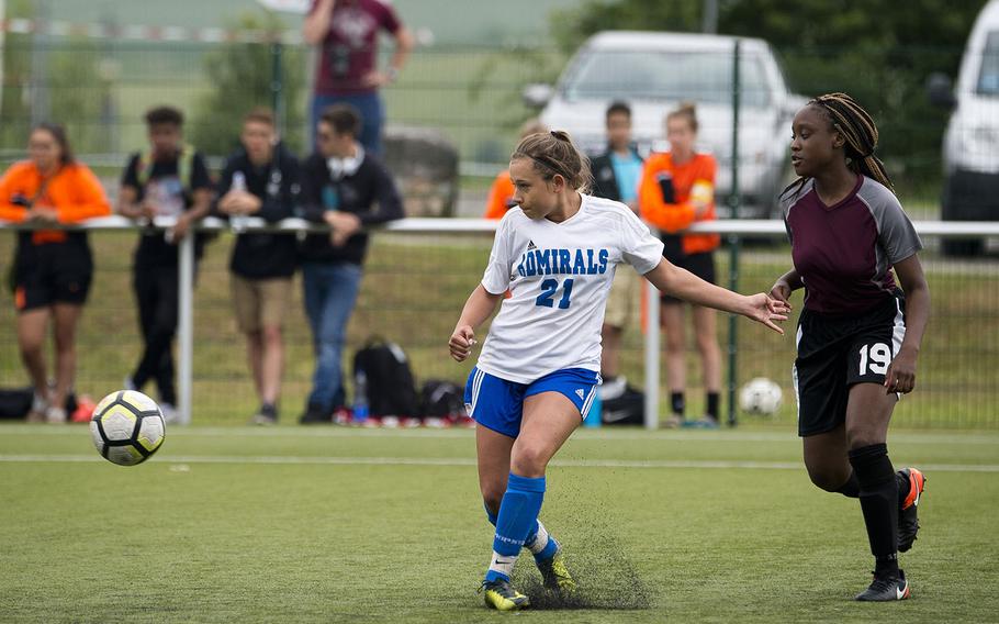Rota's Kendall Salazar, left, shoots in front of AFNORTH's Tahtyana Thomas during the DODEA-Europe soccer championships in Reichenbach, Germany, on Wednesday, May 23, 2018.
