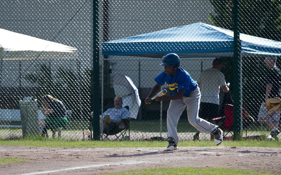Sigonella's Keshawn Campbell bunts the ball during the DODEA-Europe baseball tournament at Ramstein Air Base, Germany, on Friday, May 25, 2018.
