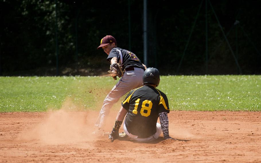 Stuttgart's Peyton Douglas, right, slides in safe at second ahead of a throw to Vilseck's Rian Ritter during the DODEA-Europe baseball tournament in Kaiserslautern, Germany, on Friday, May 25, 2018. 
