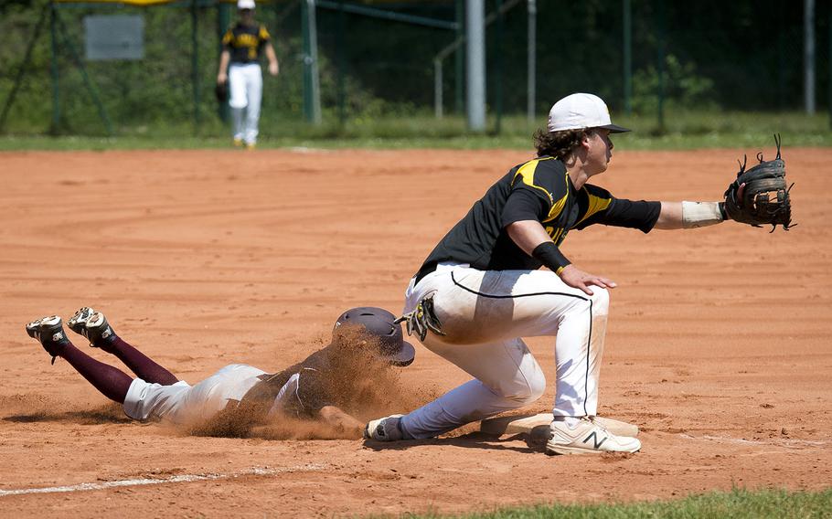 Vilseck's Johnathon Alvarado, left, slides in safe at third ahead of a throw to Stuttgart's Lisle Babock during the DODEA-Europe baseball tournament in Kaiserslautern, Germany, on Friday, May 25, 2018. 
