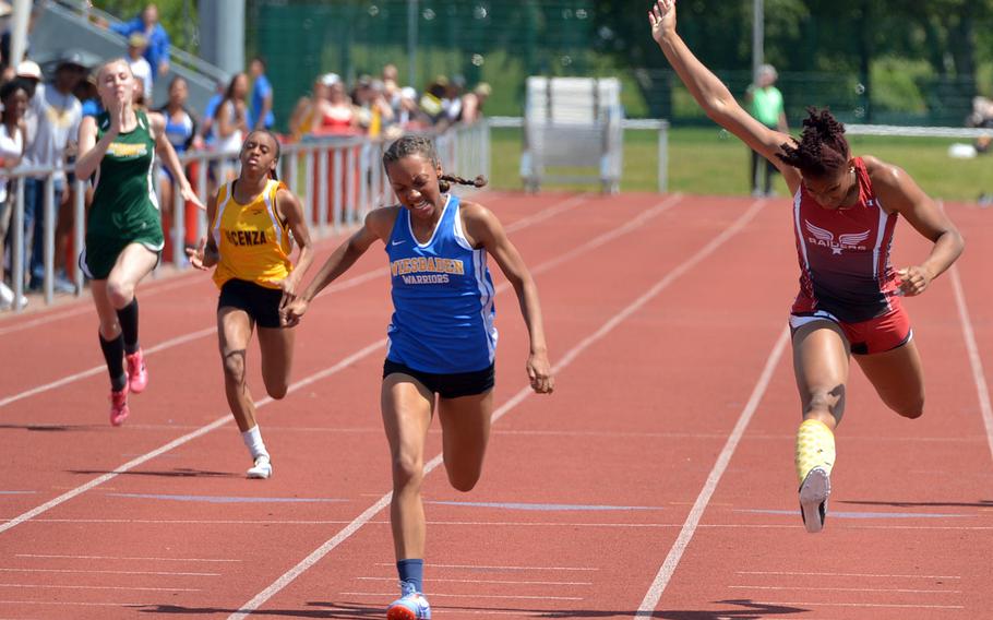 Wiesbaden's Whitney Bivins won the girls 200-meter race in 25.36 seconds ahead of Kaiserslautern's Jada Branch, right, at the DODEA-Europe track and field championships. 