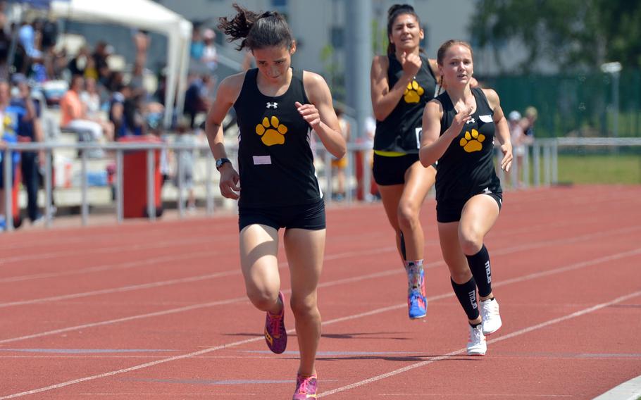 Tatiana Smith leads her Stuttgart teammates McKinley Fielding and Kate Bowman to the finish line in the girls 800-meter race at the DODEA-Europe track and field championships. Smith won in 2 minutes, 26.51 seconds.