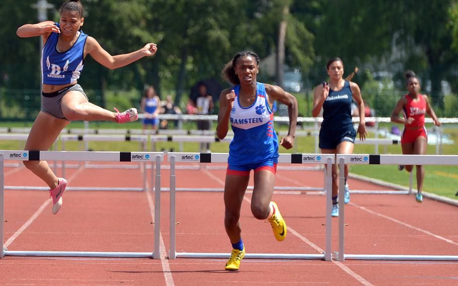 Ramstein's Christierra Williams, center, on her way to winning the girls 300-meter hurdle event at the DODEA-Europe track and field championships in 46.88 seconds.  